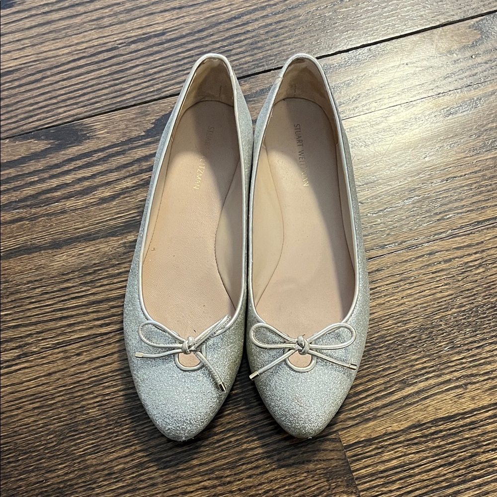 Stuart Weitzman Gabby Flat in Platino gold.